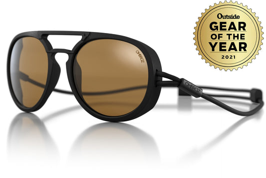 dolomite_charcoal_yellow Tilted shot of Ombraz UNISEX armless string sunglasses, gear of the year award