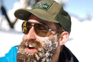Tortoise_yellow Man with snow in his beard wearing Ombraz classic armless sunglasses with cord