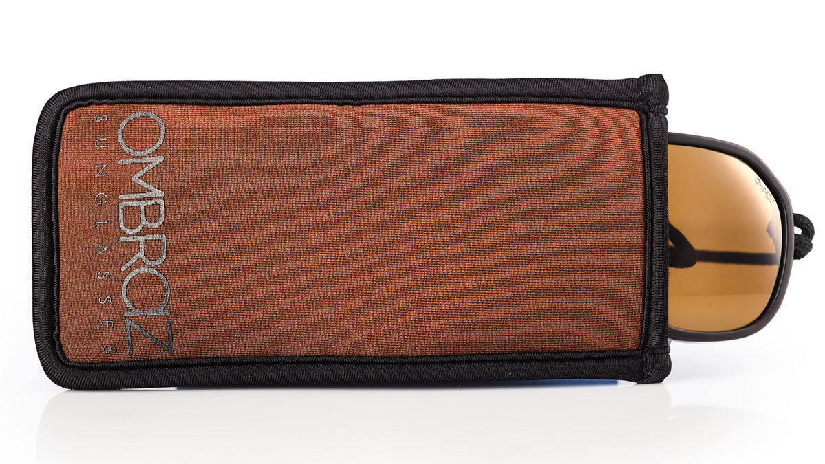 Neoprene Case with Built-In Microfiber - Ombraz solve what frustrates you about sunglasses. Handmade frames attach directly to an adjustable cord that keeps the sunglasses securely & comfortably in place. 2019 Sunglass of the year from Backpacker Magazine, Ombraz are lightweight, easy to pack & stow & are equipped with world-class polarized Zeiss lenses. Armless sunglasses with a built-in cord. 