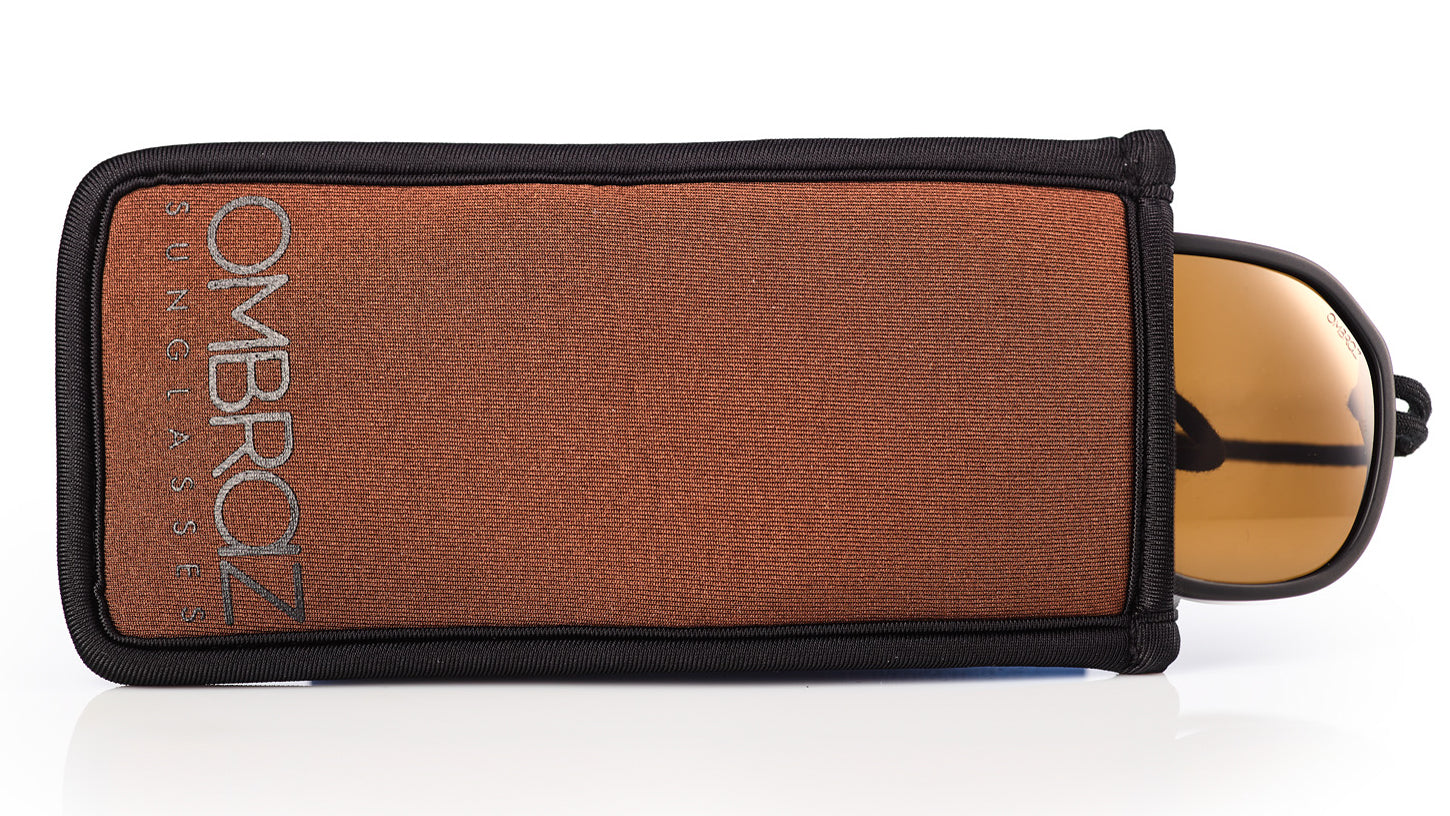 Neoprene Case with Built-In Microfiber - Ombraz solve what frustrates you about sunglasses. Handmade frames attach directly to an adjustable cord that keeps the sunglasses securely & comfortably in place. 2019 Sunglass of the year from Backpacker Magazine, Ombraz are lightweight, easy to pack & stow & are equipped with world-class polarized Zeiss lenses. Armless sunglasses with a built-in cord. 