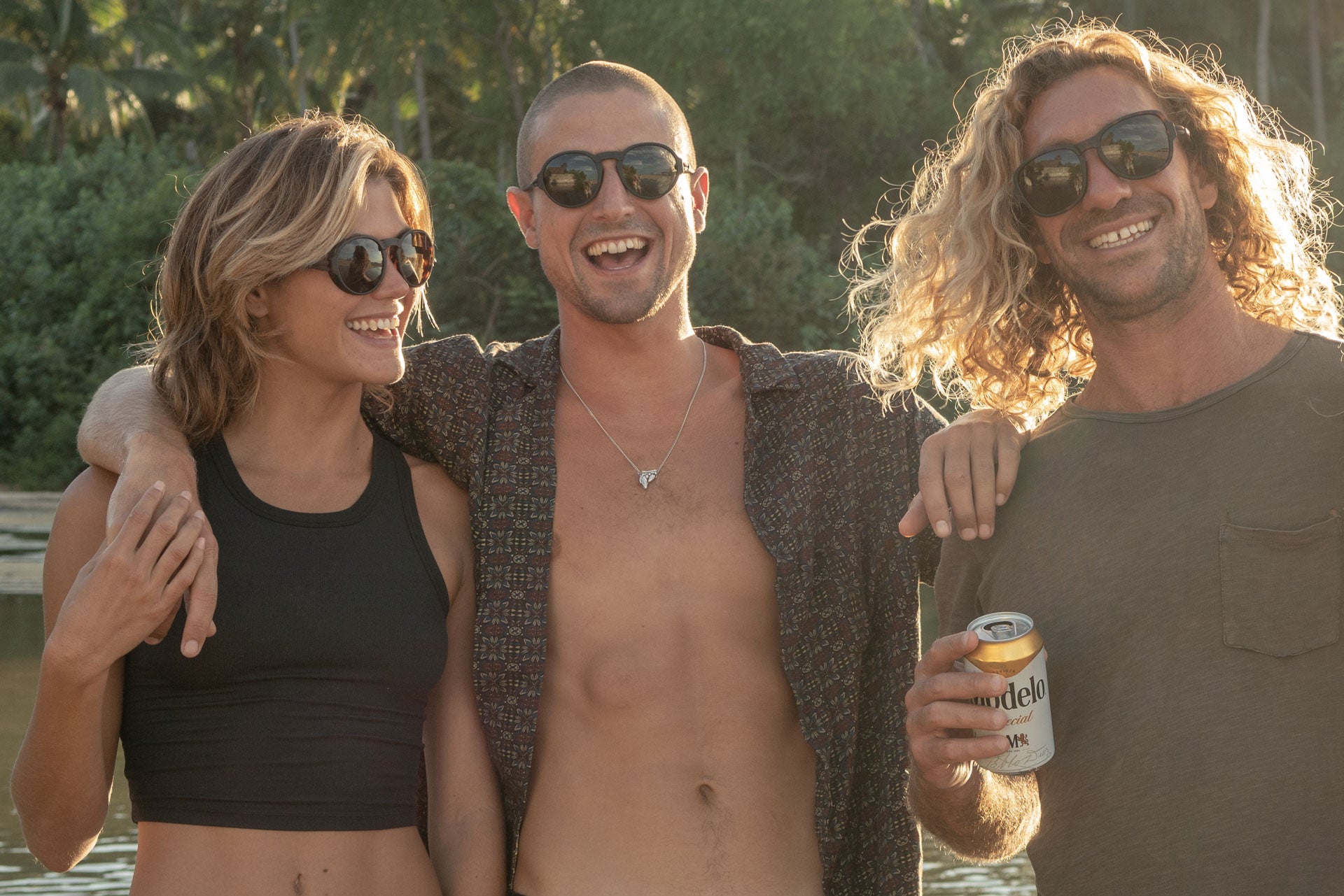TETON_TORTOISE_GREY Three people smiling wearing Ombraz armless rope sunglasses