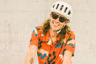 leggero_tortoise_grey Man biking with his tongue out wearing Ombraz armless rope sunglasses