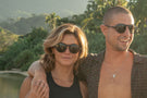 VIALE_DUSK_GREY Man and woman smiling wearing Ombraz viale armless strap sunglasses